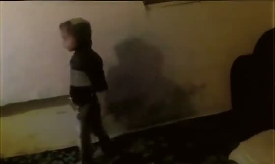 Vansh as a toddler walking along a wall