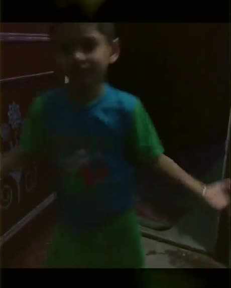 Vansh as a young boy, grinning