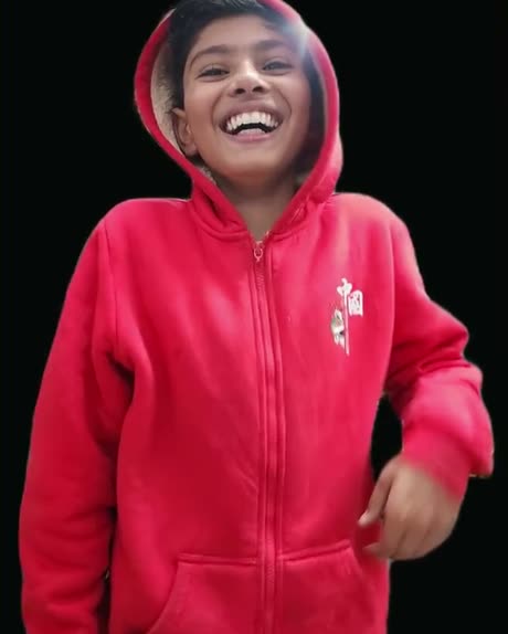Vansh laughing in a red hoodie